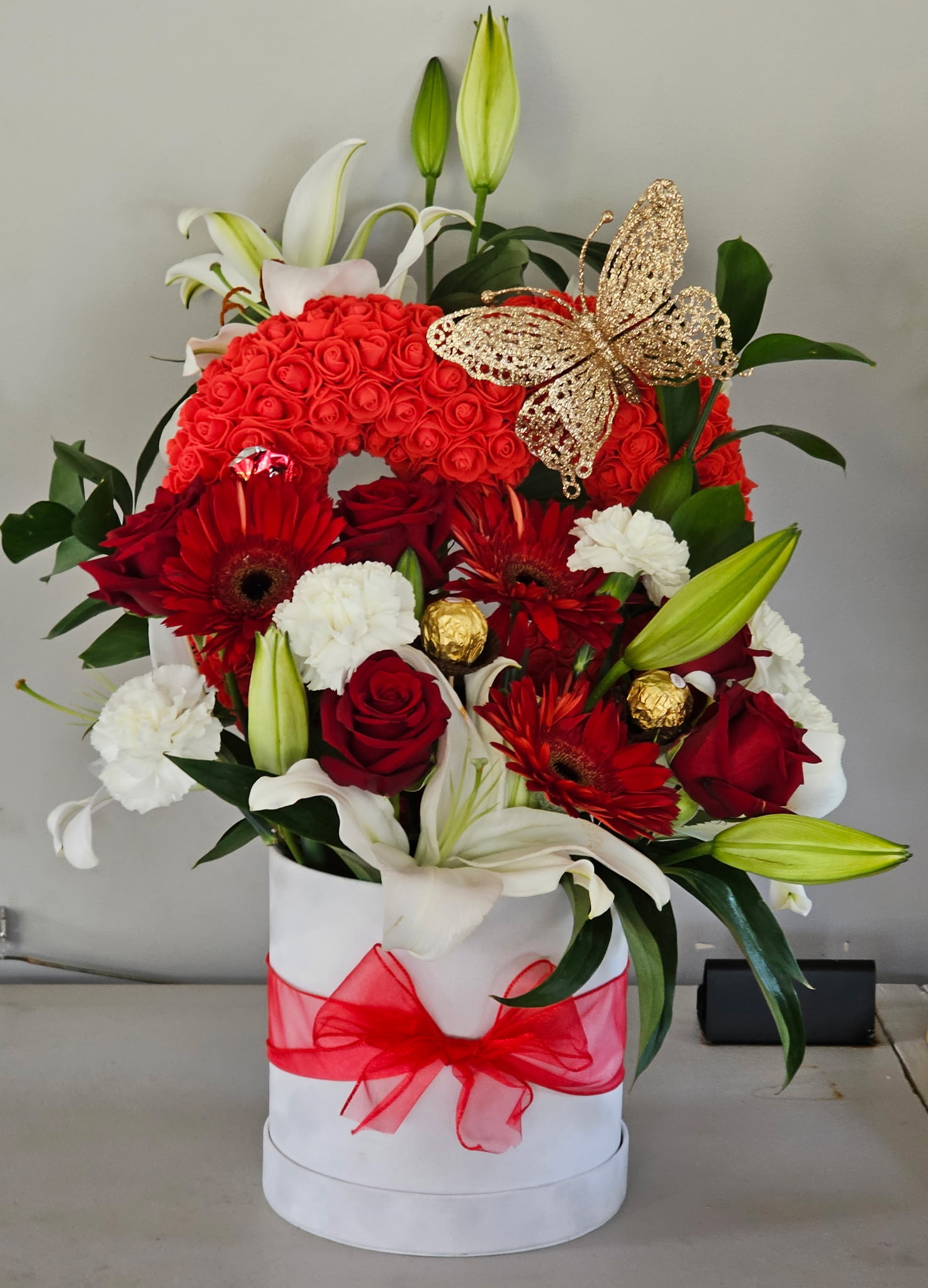 Red rose heart arrangement with lilies